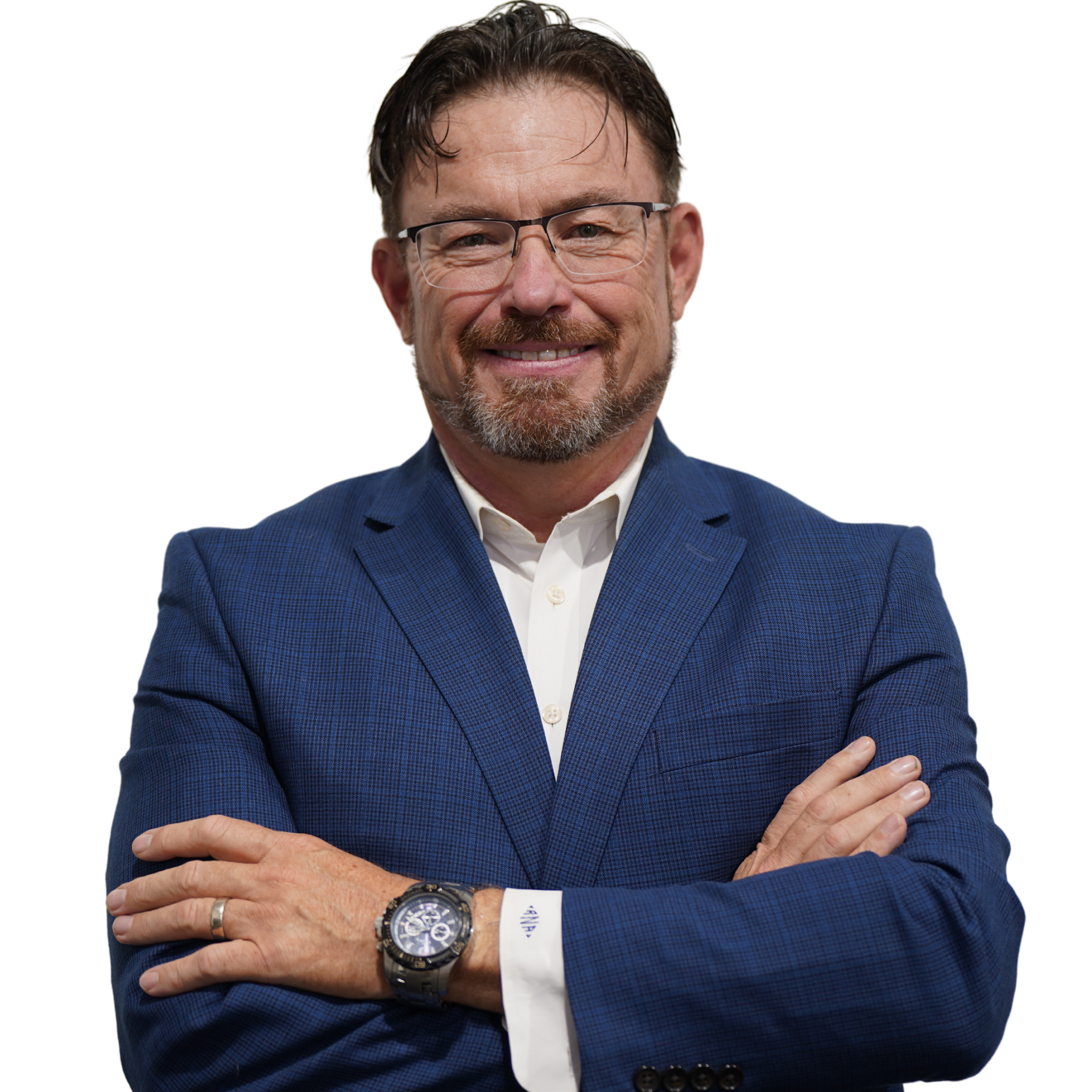 Smiling man in blue blazer with arms crossed against a white background