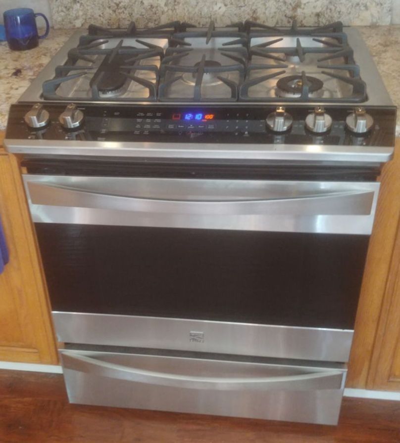 A stainless steel stove top oven in a kitchen