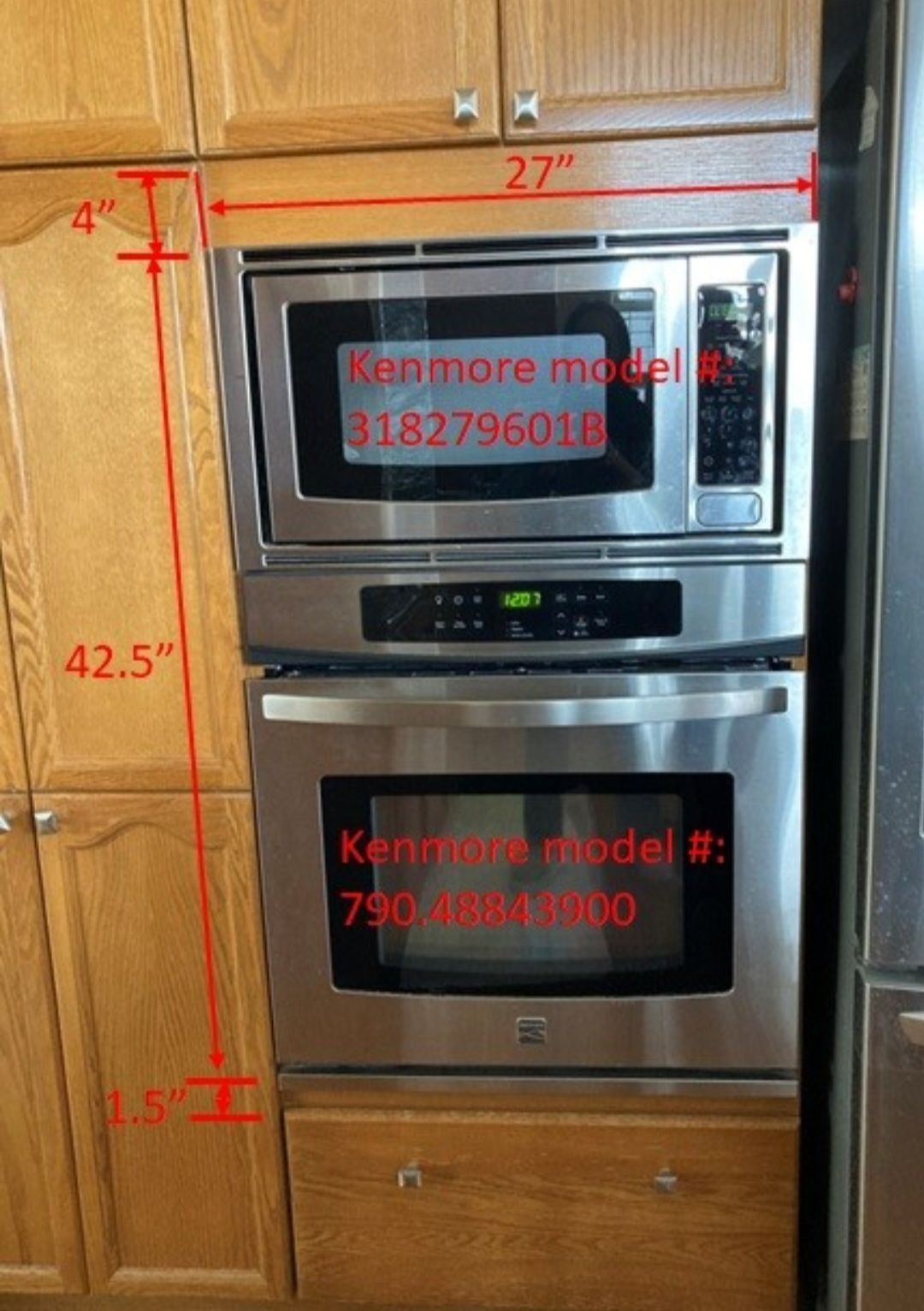 A kitchen with a stainless steel oven and microwave.