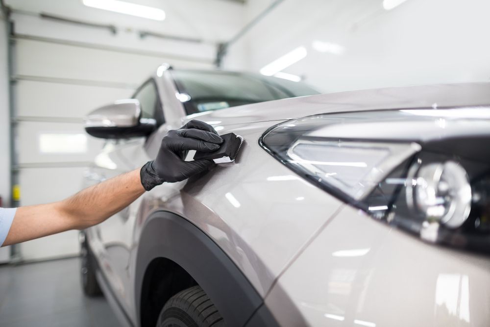 A Purple Car is Parked in Front of a Garage — Platinum Hand Car Wash & Detailing in Belconnen, ACT