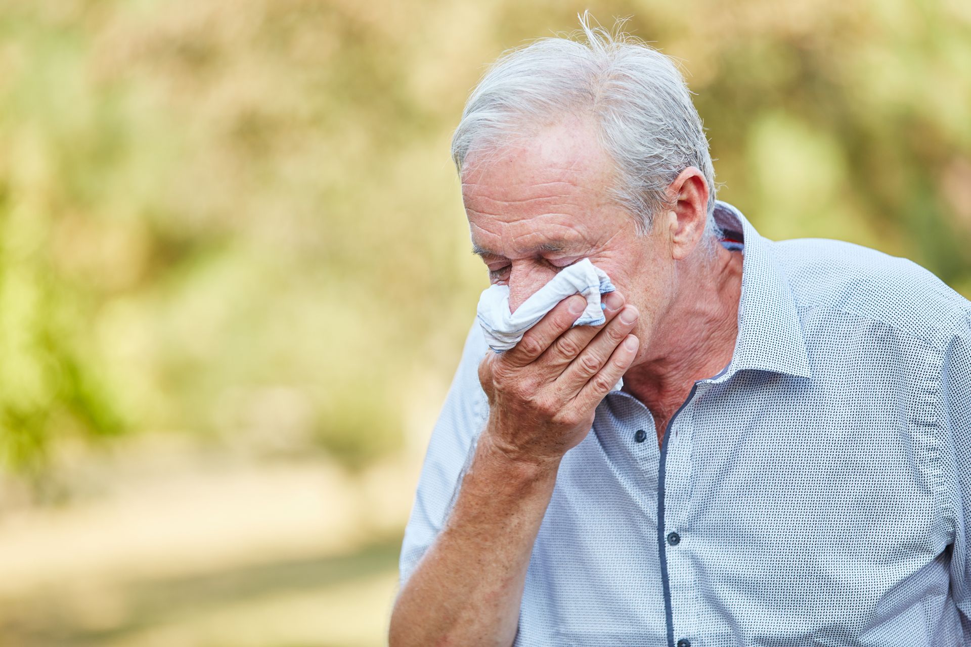 A senior citizen with spring allergies A senior citizen with spring allergies