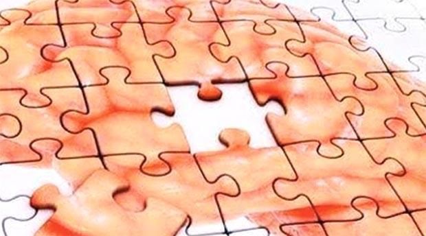 Un rompecabezas de un cerebro al que le falta una pieza.