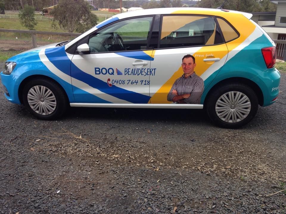 A car with a man on the side that says boo on it
