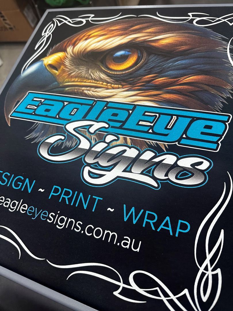 A sign for eagle eye signs with an eagle on it