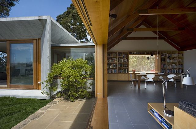A Living Room With A Sliding Glass Door Leading To A Dining Room – Cambridge, TAS - Bennett Construction (TAS)