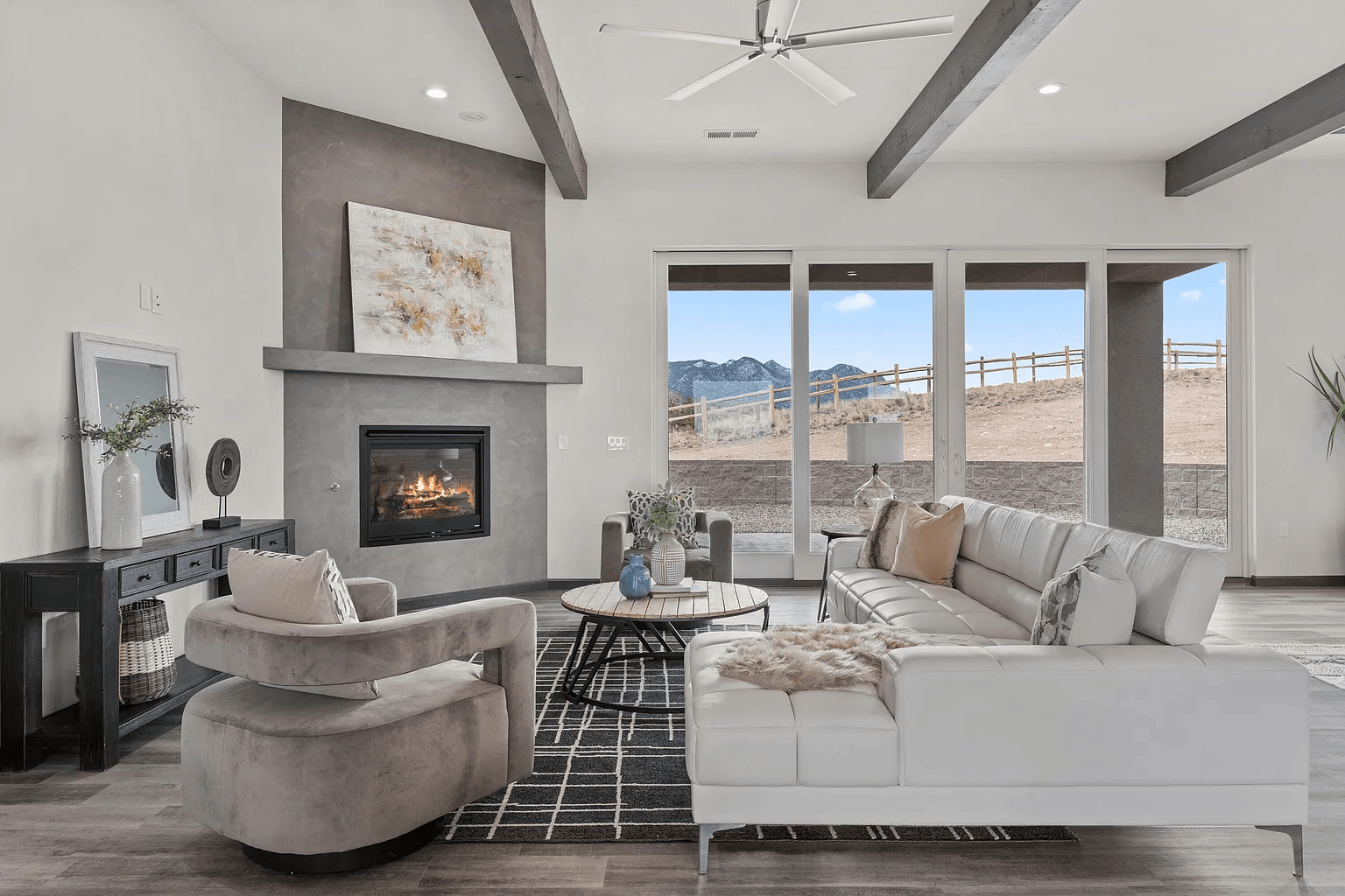 A living room filled with furniture and a fireplace.