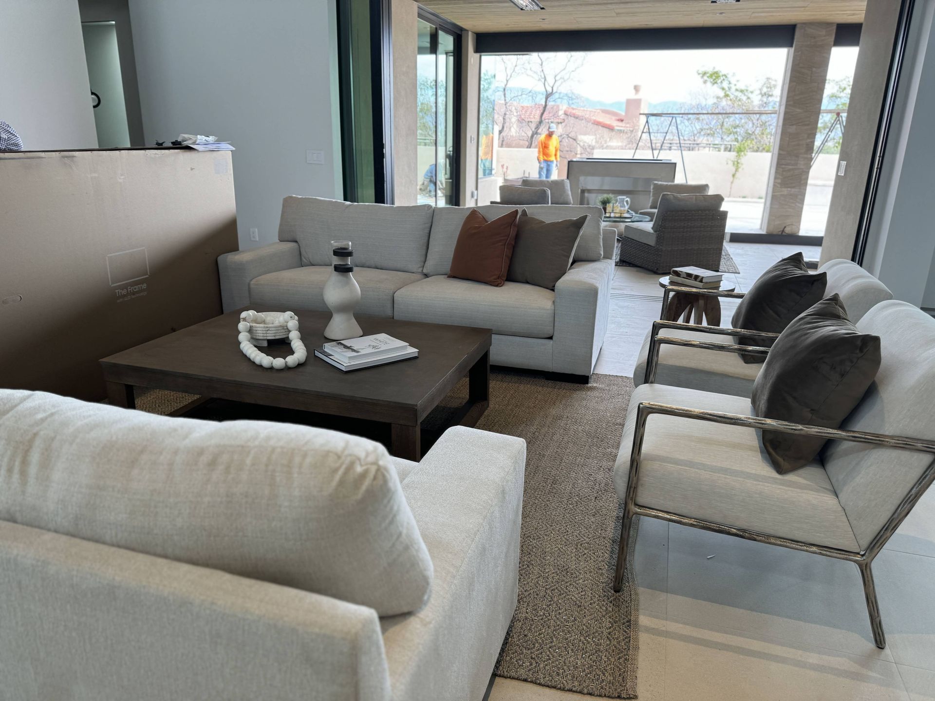 A living room with a couch , chairs and a coffee table