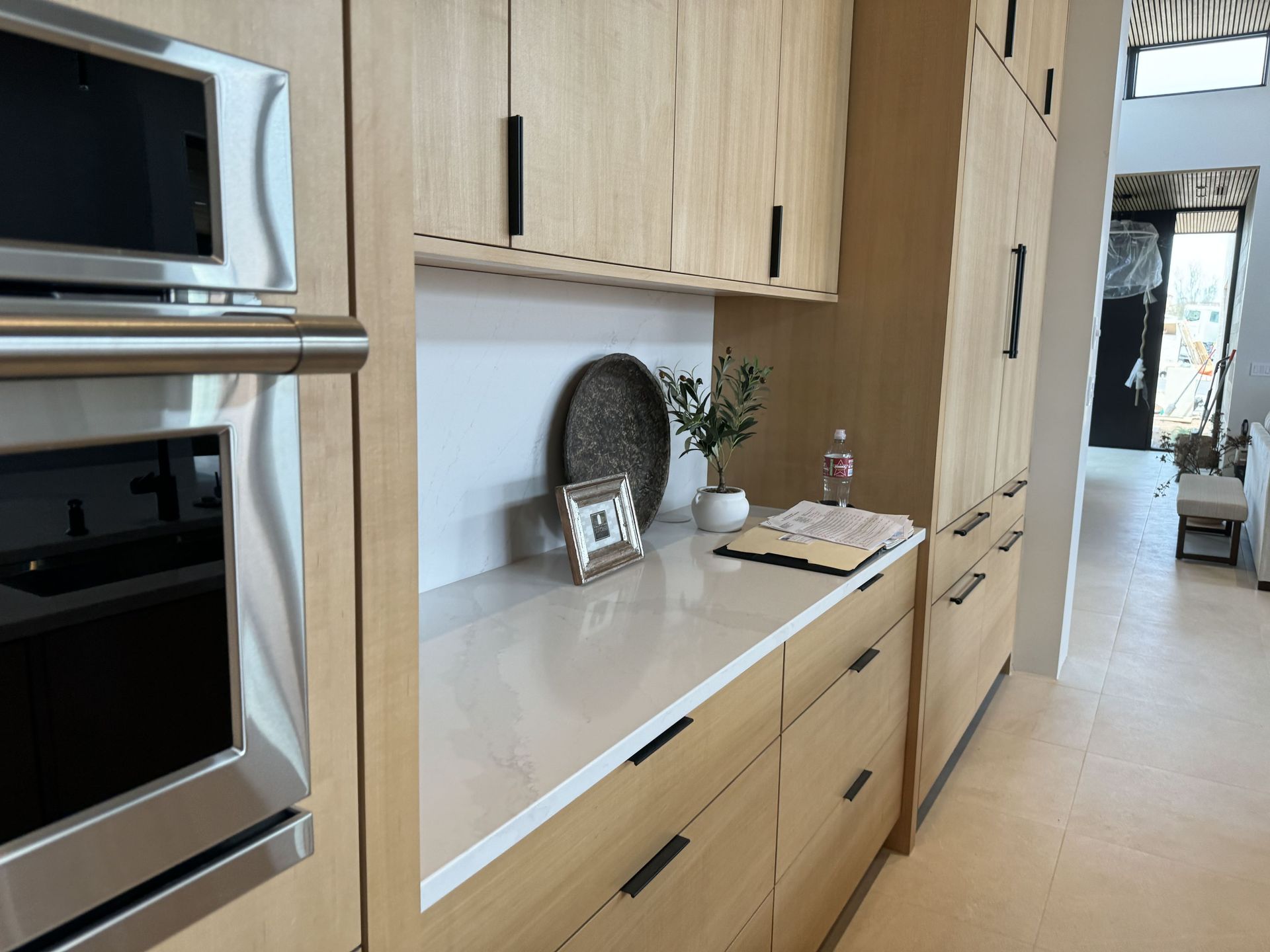 A kitchen with wooden cabinets and stainless steel appliances