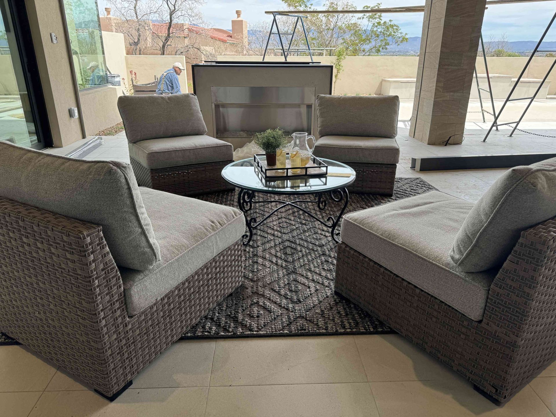 A living room with wicker furniture and a coffee table