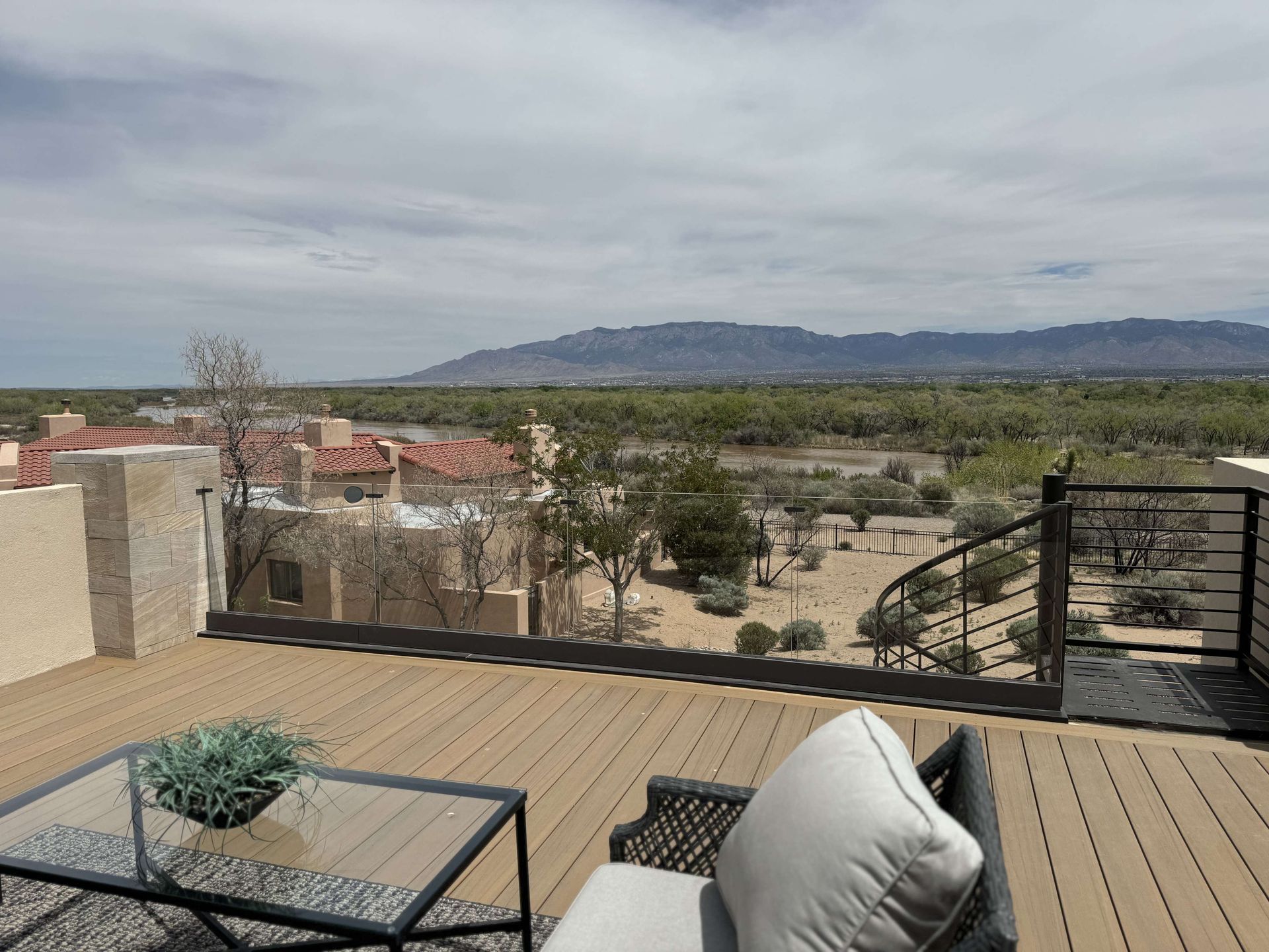 A patio with a view of the desert and mountains.