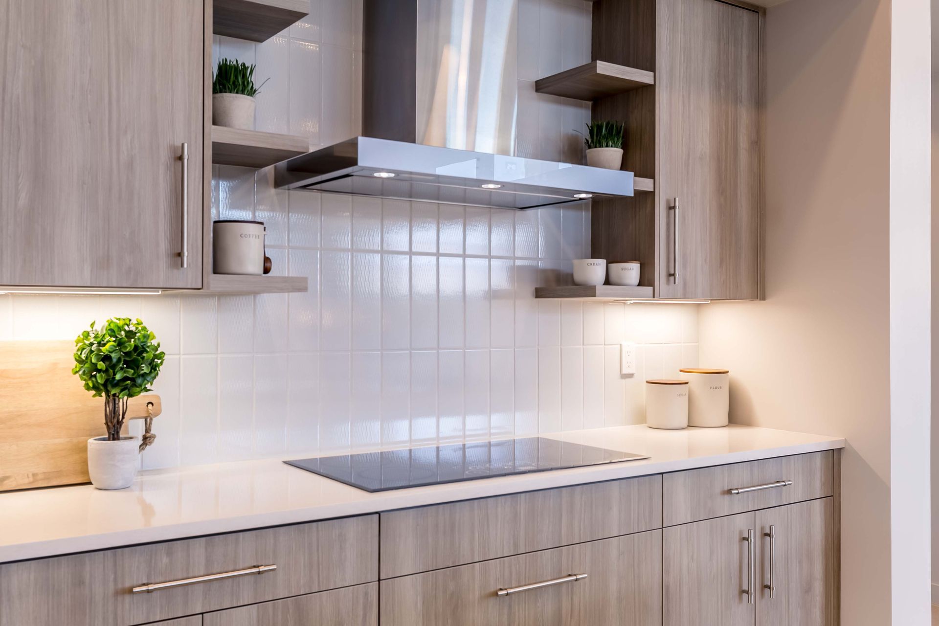 A kitchen with stainless steel appliances and wooden cabinets
