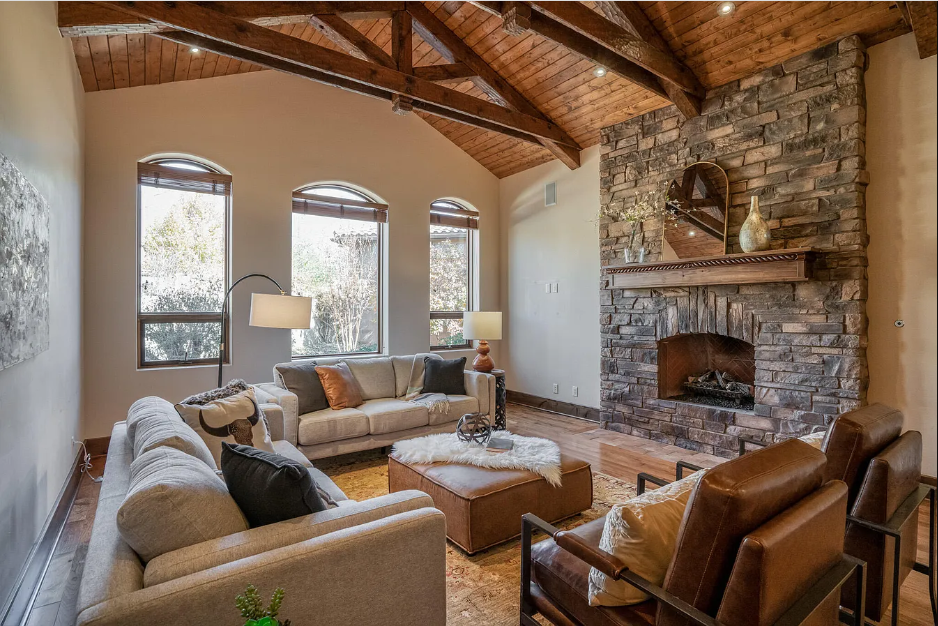 A living room filled with furniture and a fireplace.
