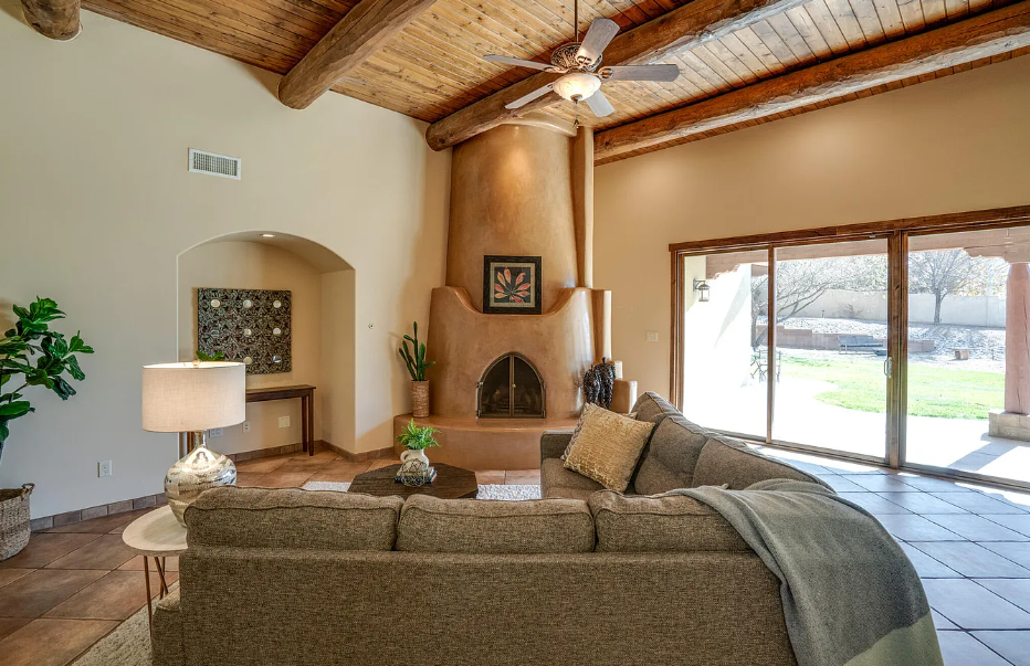 A living room with a couch and a fireplace