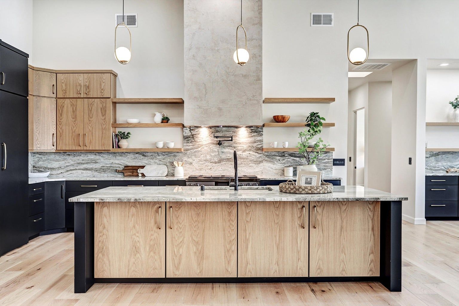A kitchen with a large island in the middle of the room.
