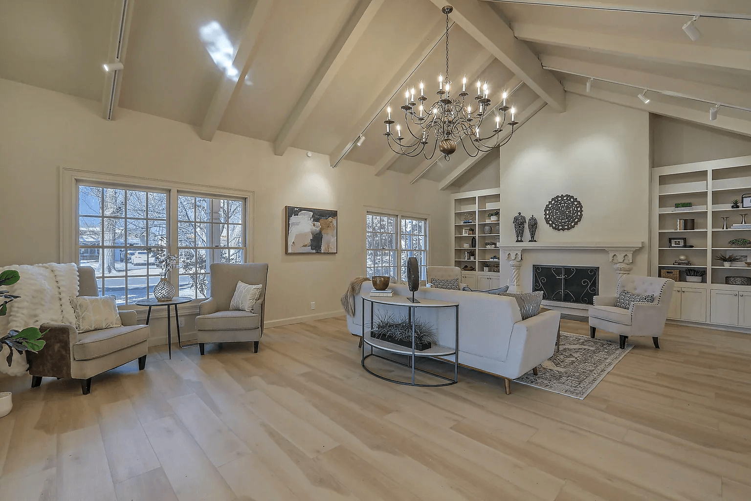 A living room filled with furniture and a fireplace.