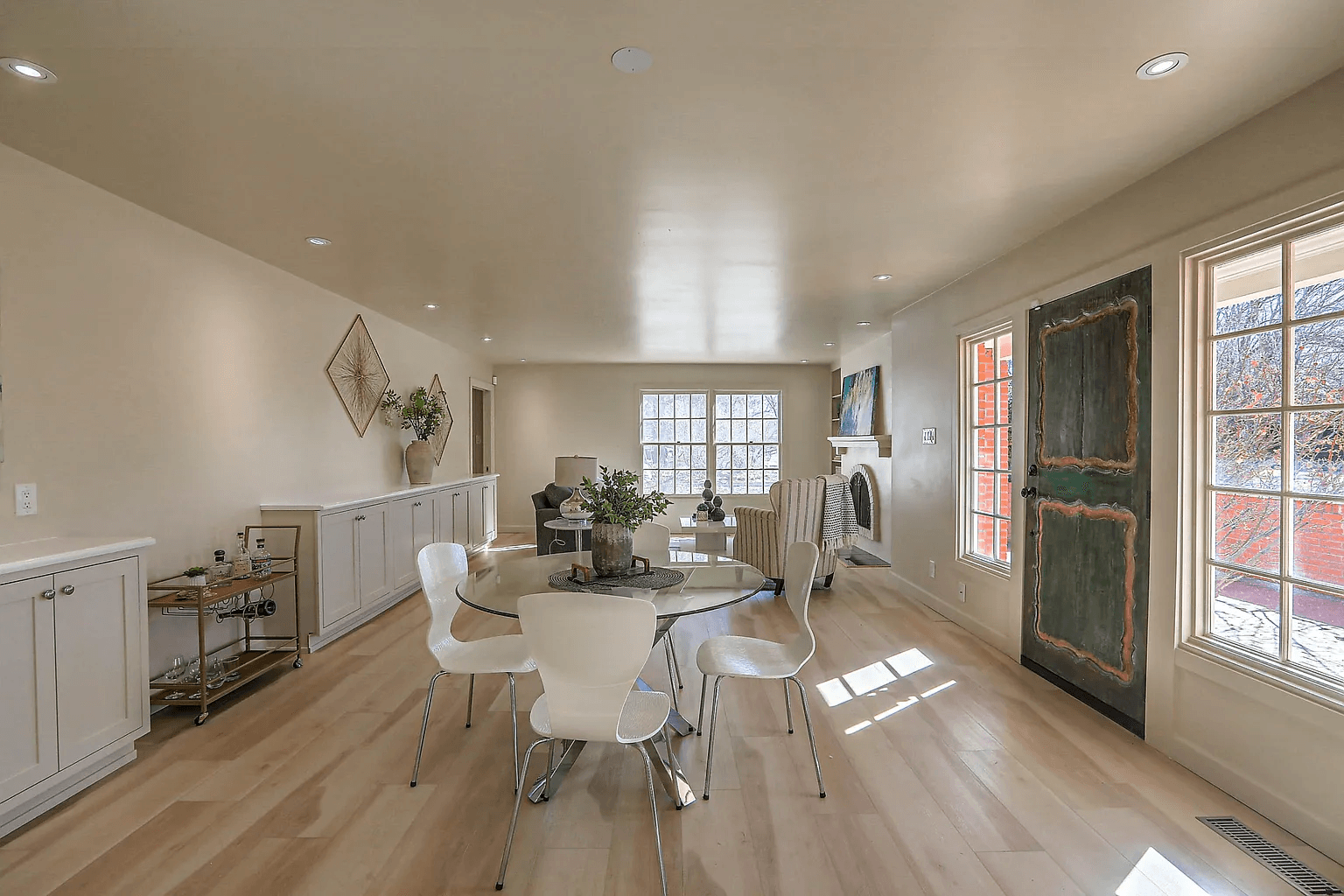 A large room with a dining table and chairs in it