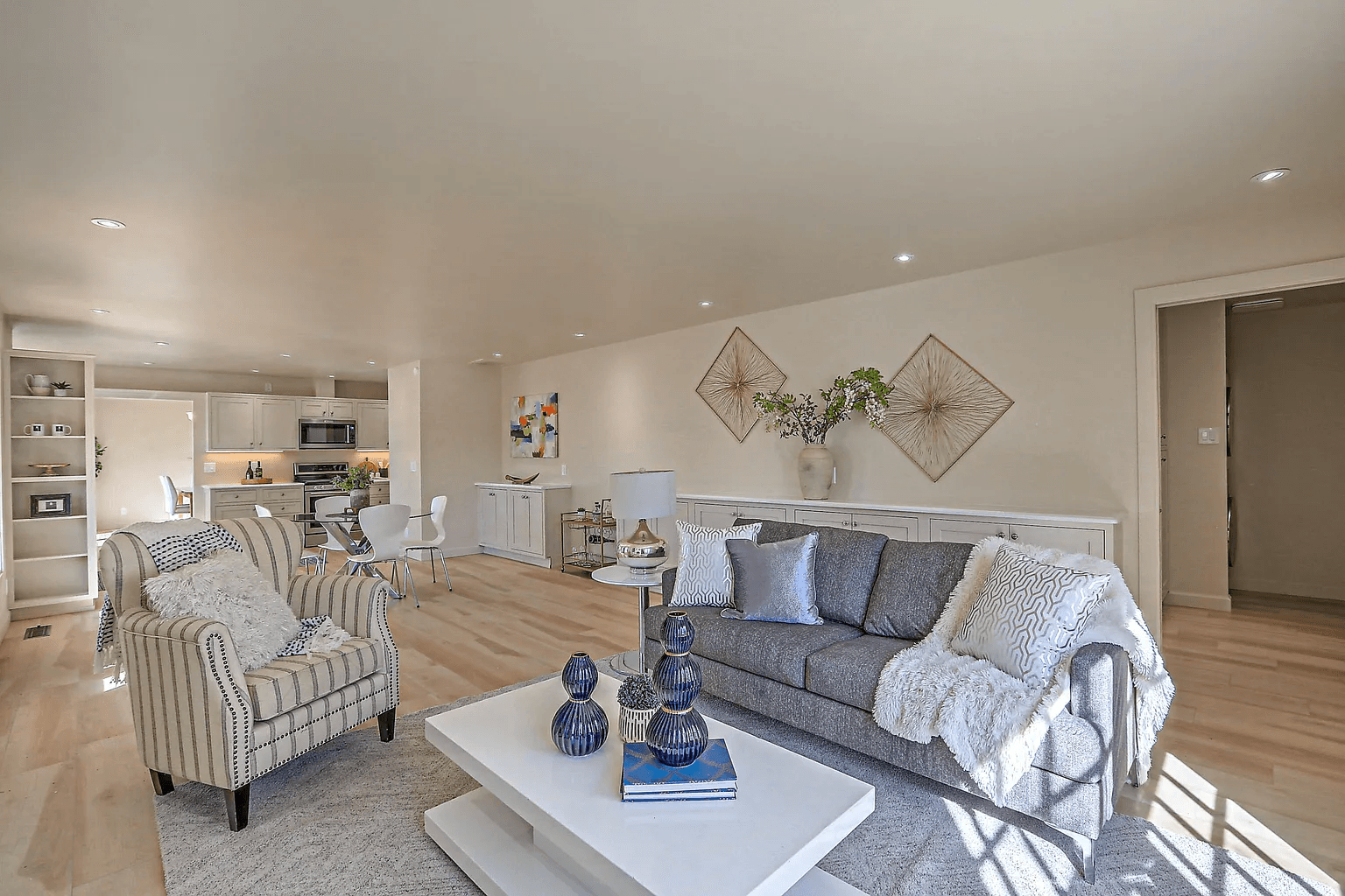 A living room with a couch , chair , and coffee table.