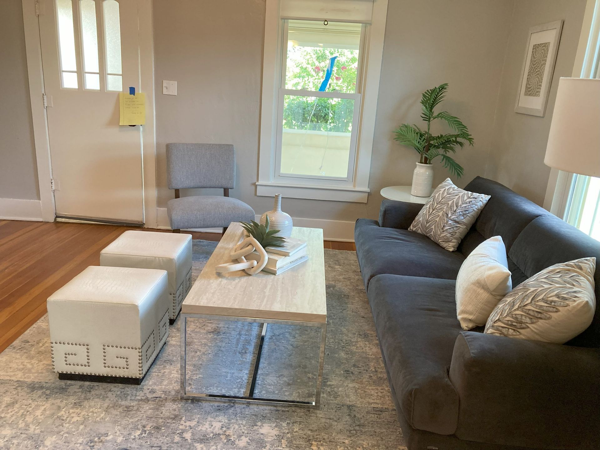 A living room with a couch and a coffee table
