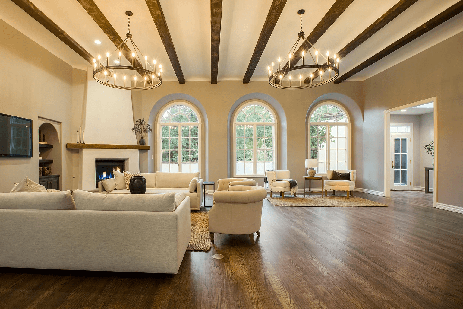 A living room with a lot of furniture and a fireplace.