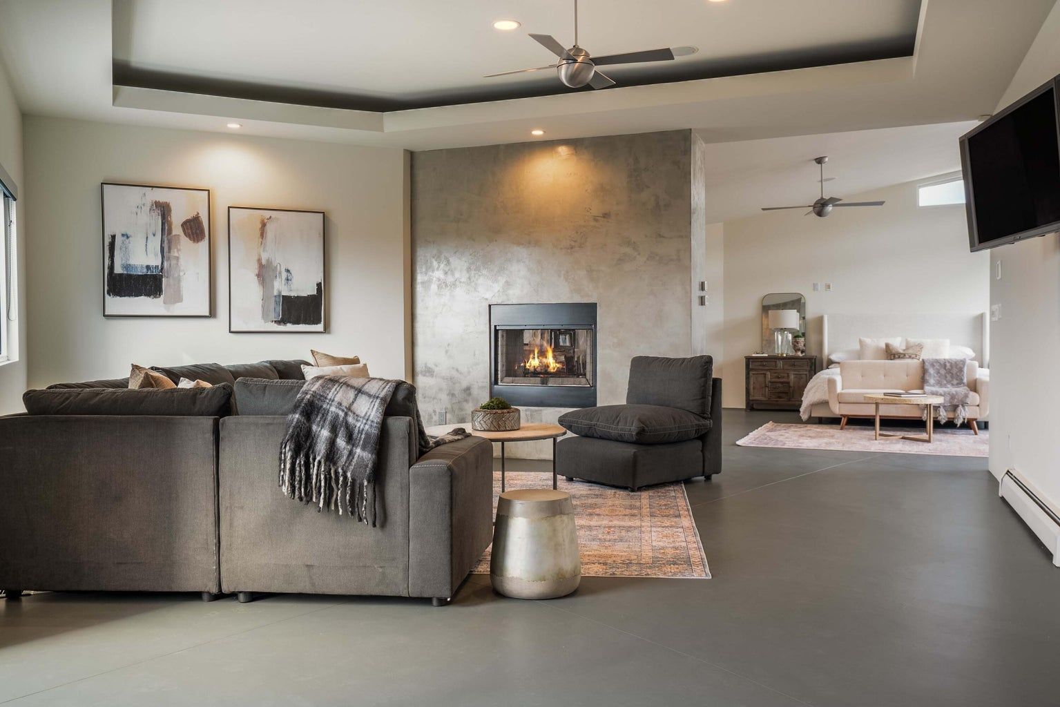 There is a fireplace in the middle of the living room.