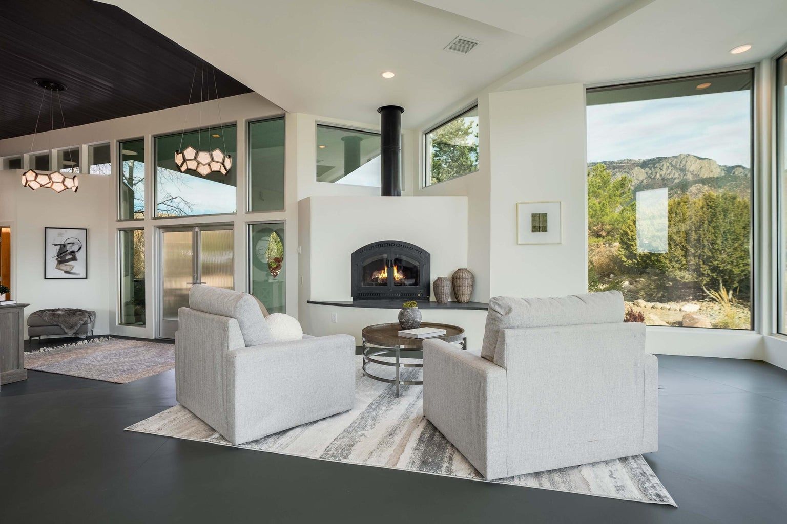 There is a fireplace in the middle of the living room.