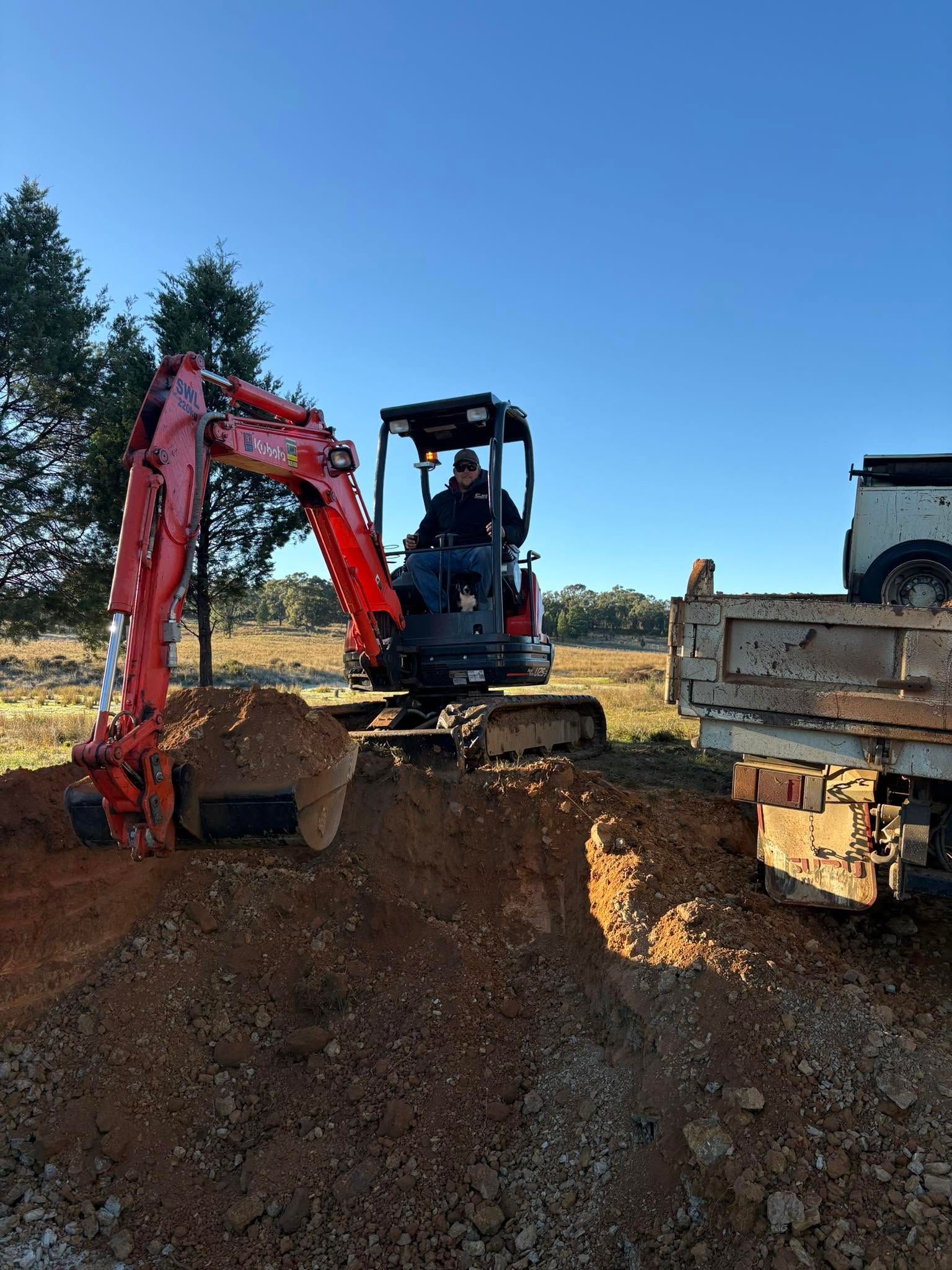 Excavator completing earthmoving work on a regional site