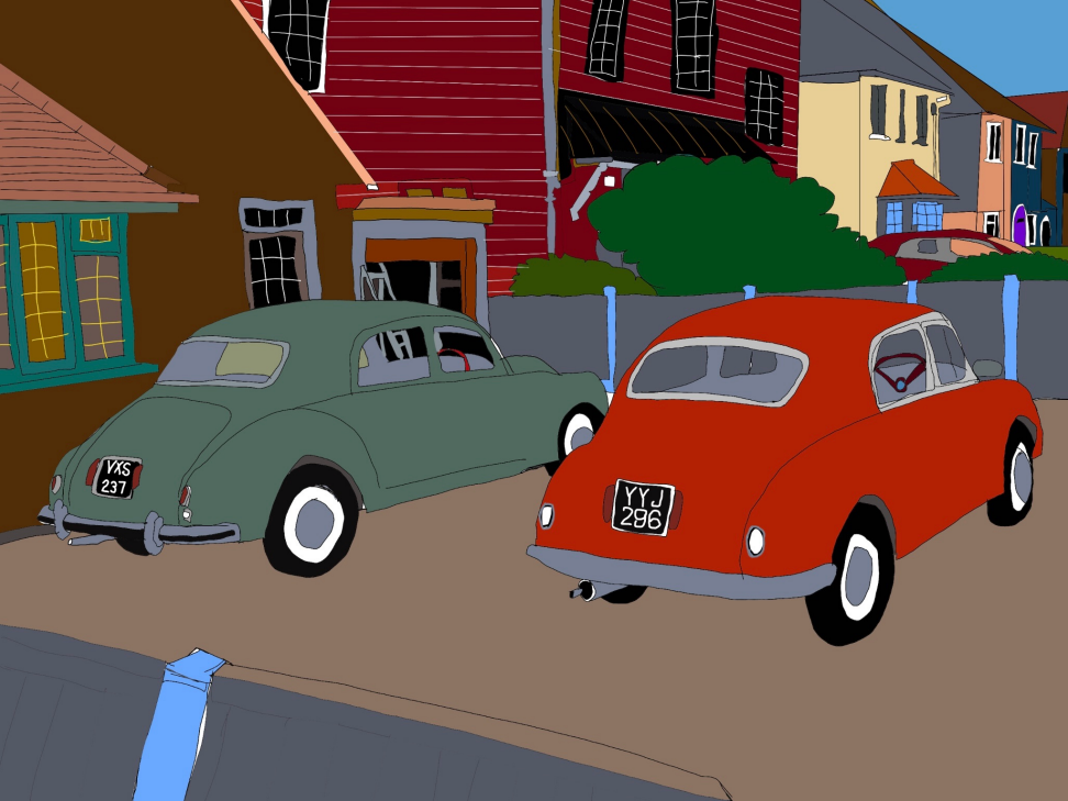 Two vintage cars, one gray and one red, parked on a street lined with colorful houses.