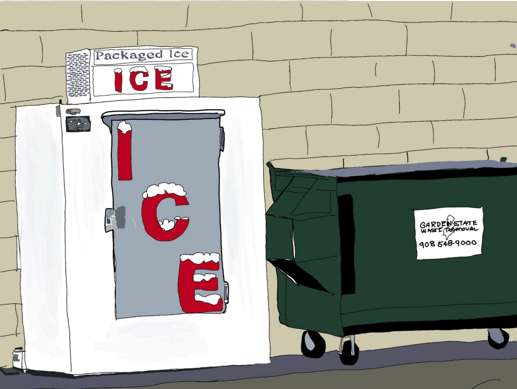 Ice machine with open door beside a green dumpster against a brick wall.