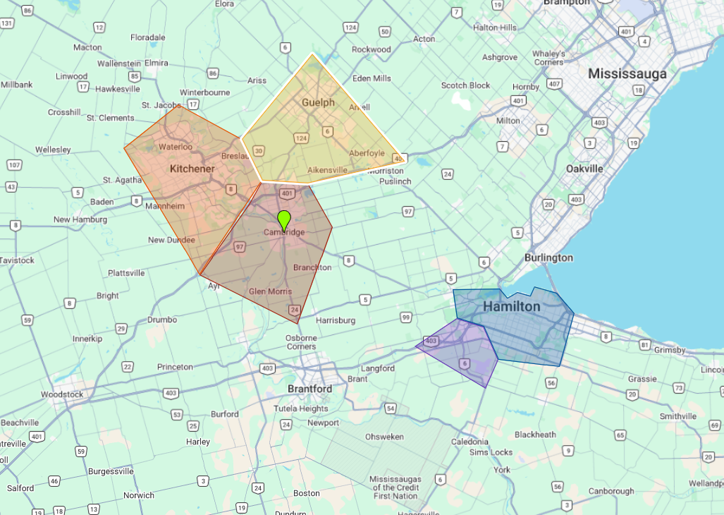 Map of an area with colored polygons overlaying it, with a green dot in the center.