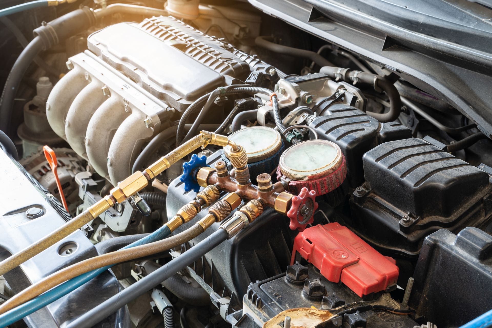 AC unit of a vehicle is being checked with a manometer. AC unit of a vehicle is being checked with a manometer.