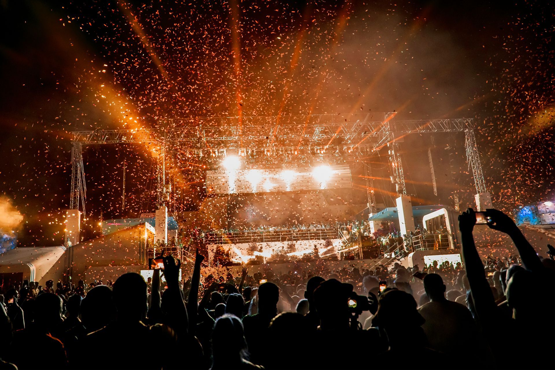 A concert featuring intense stage lighting and pyrotechnics.