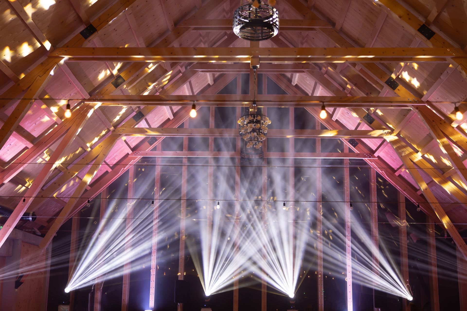 Moving light beams on the ceiling in a wedding.