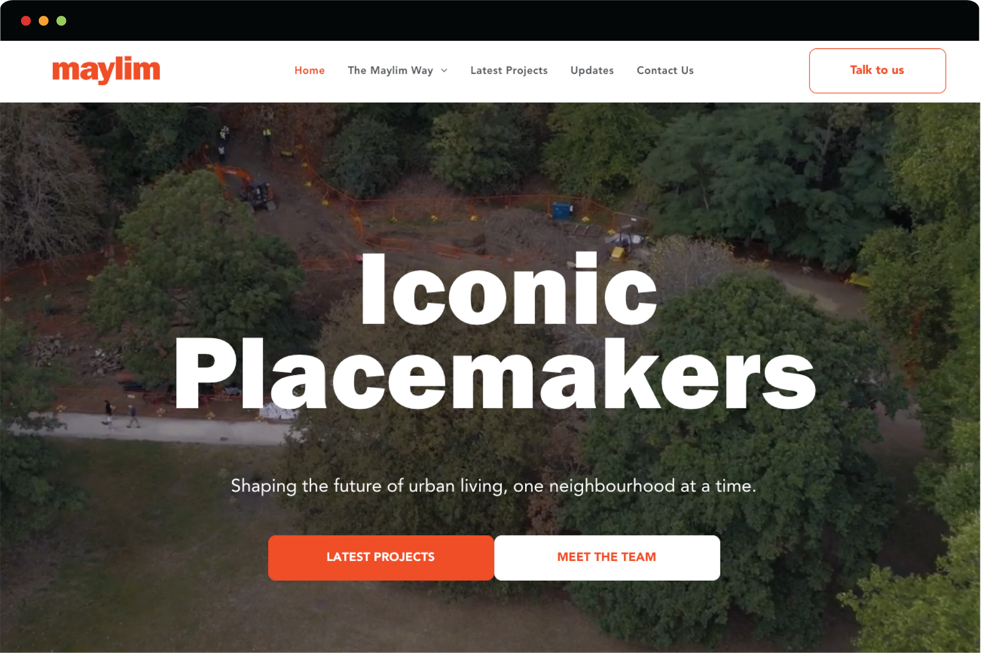 Website homepage hero showing a city street scene with the title “district” overlaid.