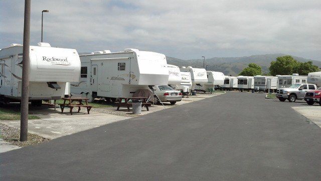 A row of rvs parked on the side of a road