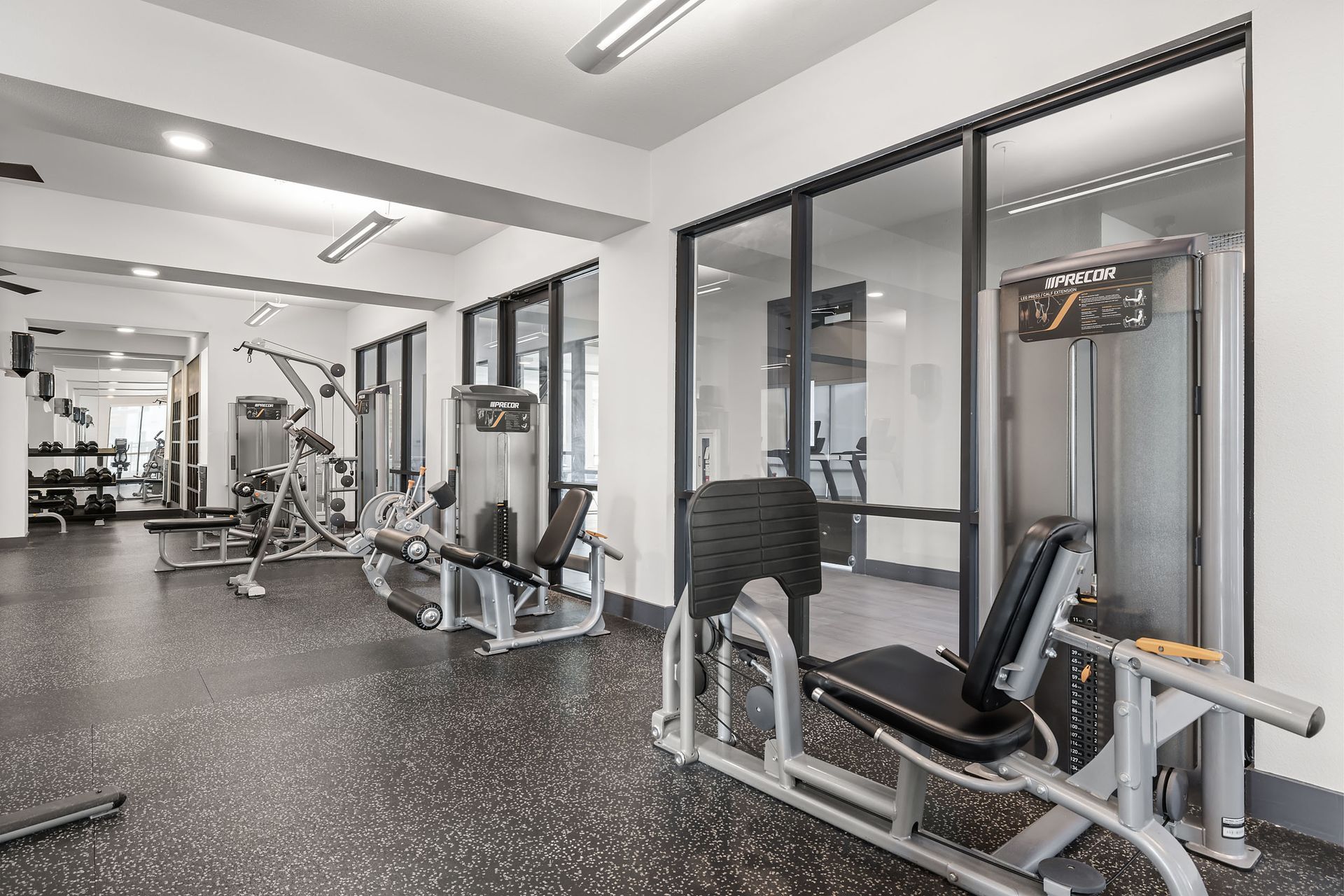 A large gym filled with lots of exercise equipment at The Heights offers student apartments for rent near SHSU in Huntsville, TX.
