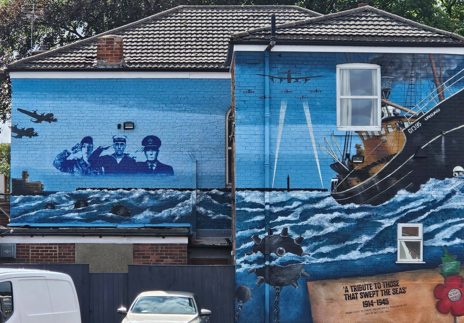 A colorful mural on a building, labeled 
