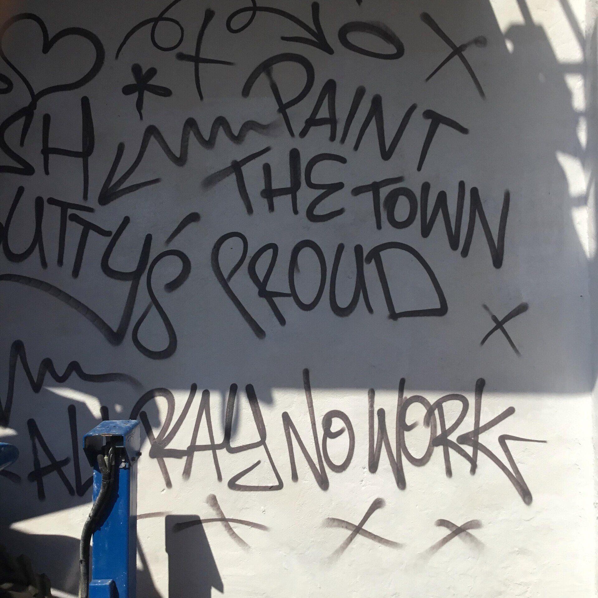Graffiti on a wall that says