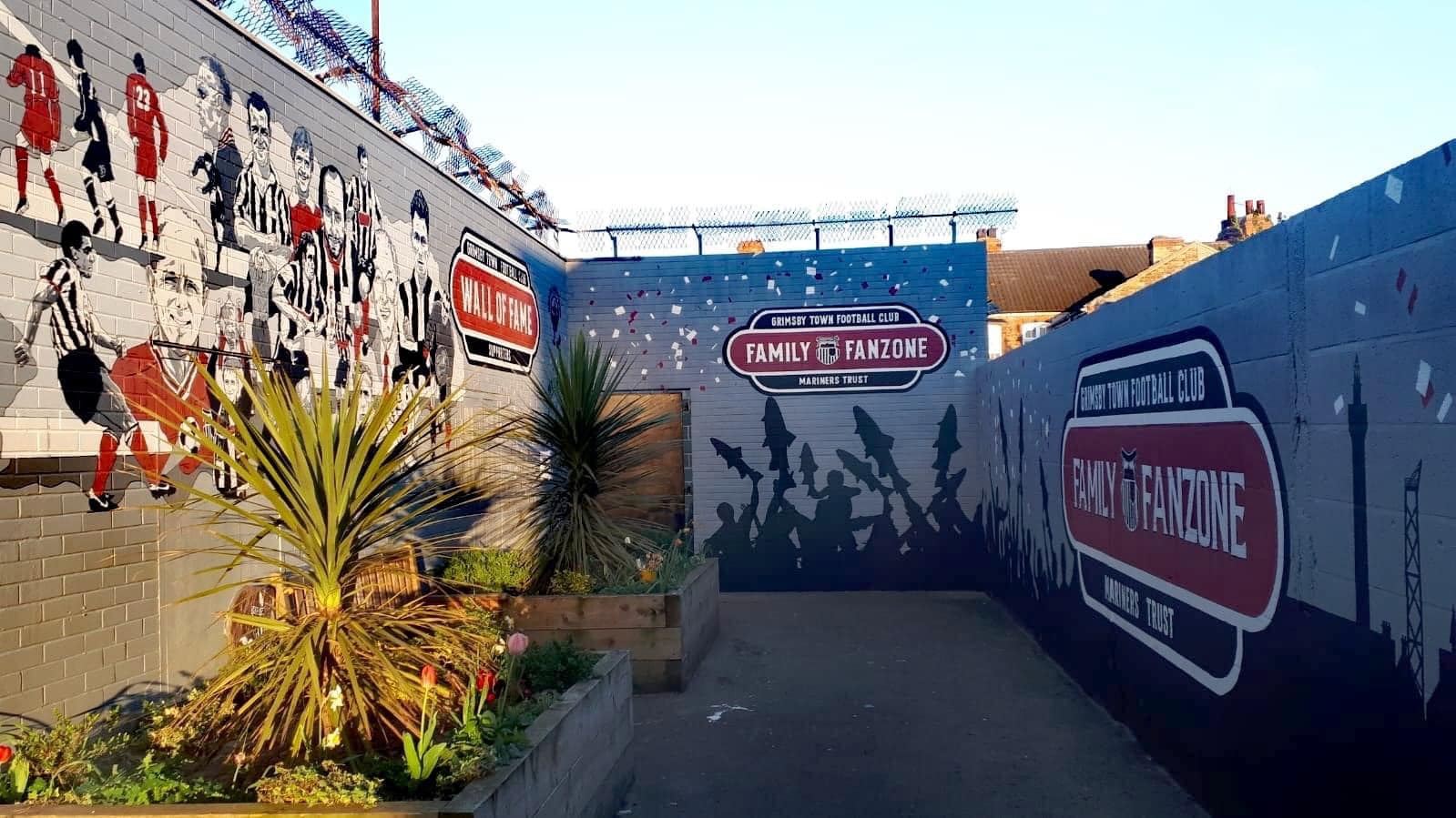 There is a mural on the side of a building.