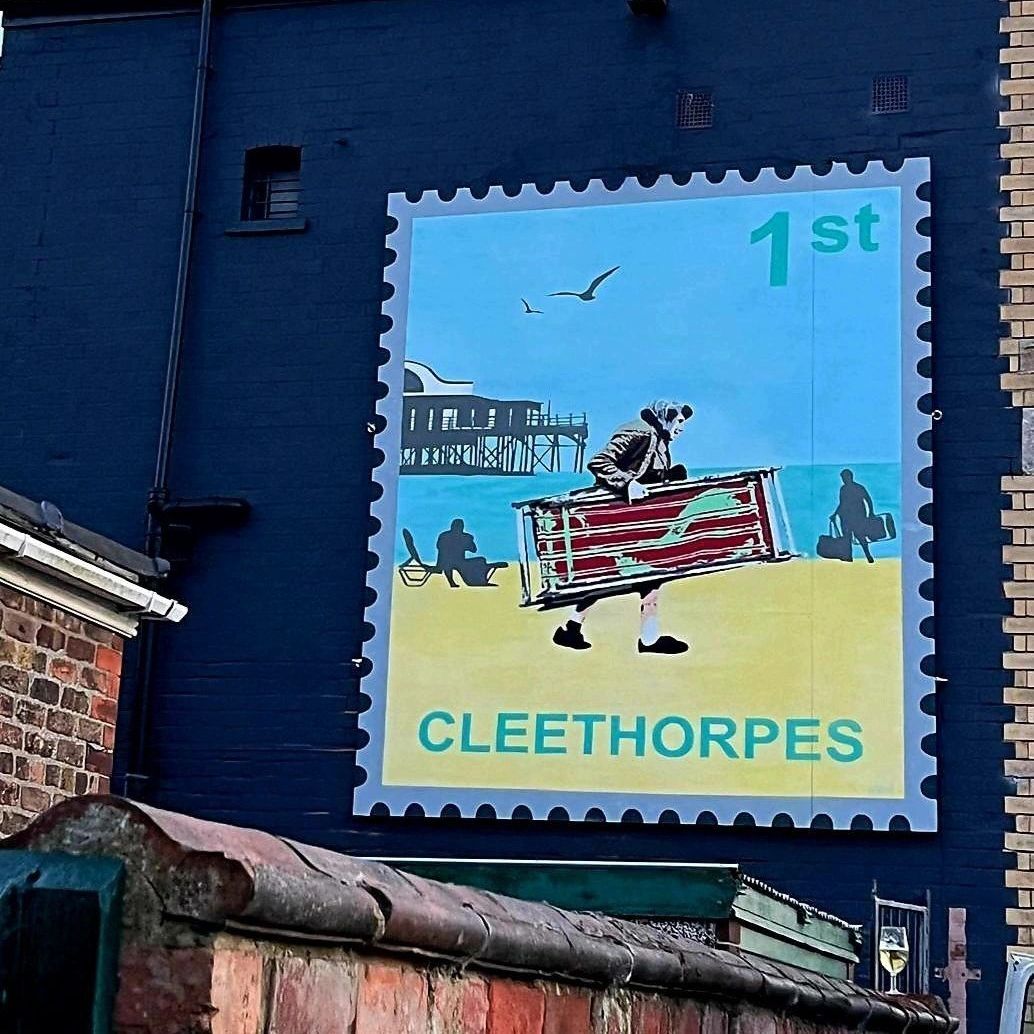 A painting on a wall that says cleethorpes on it