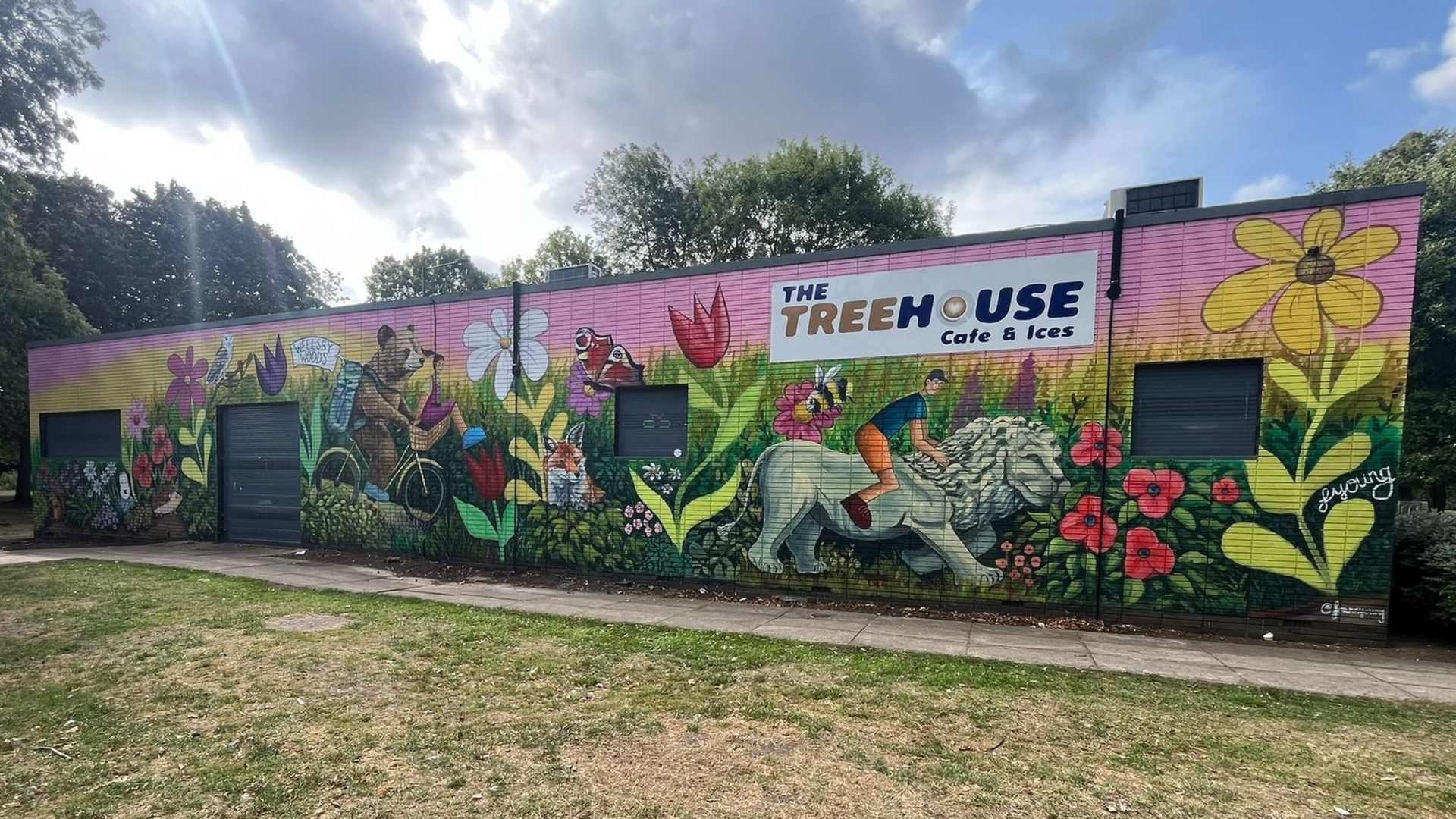 A colorful mural on a building, labeled 