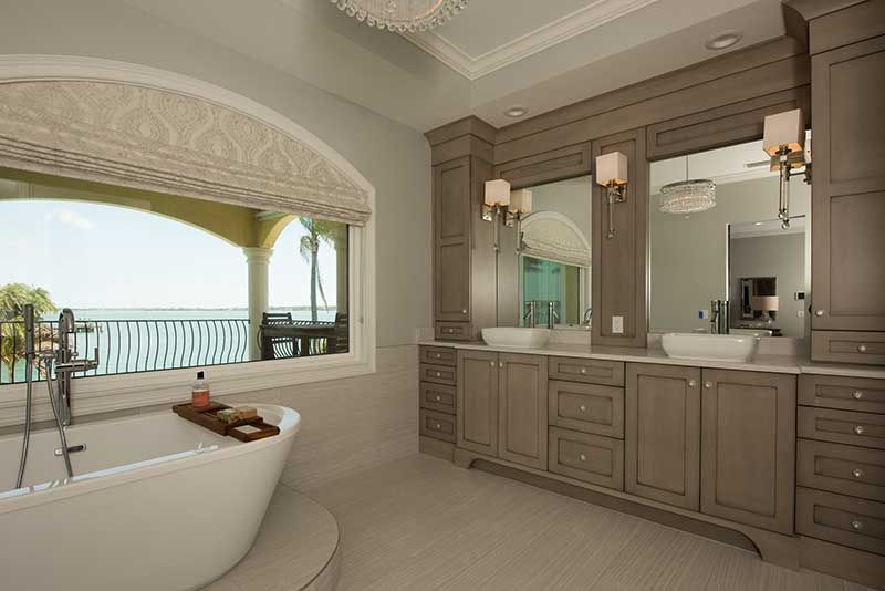 A bathroom with a bathtub and two sinks