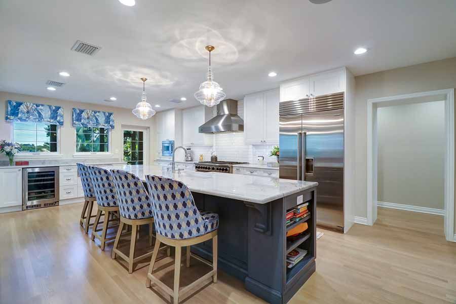 There is a large island in the middle of the kitchen.