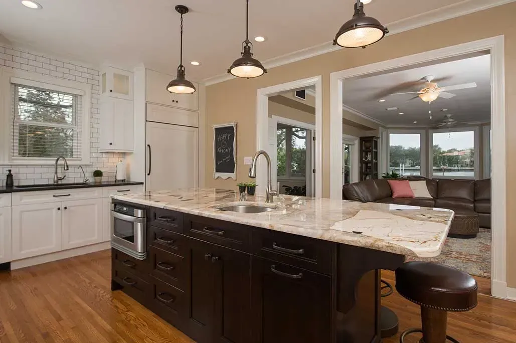 There is a large island in the middle of the kitchen.