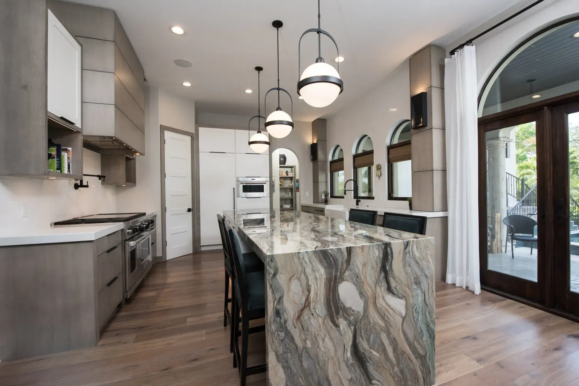 There is a large island in the middle of the kitchen.