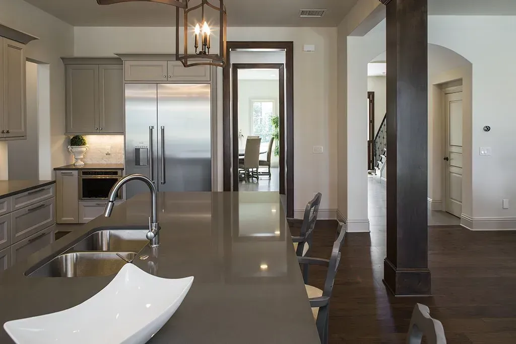A kitchen with a sink and a bowl on the counter