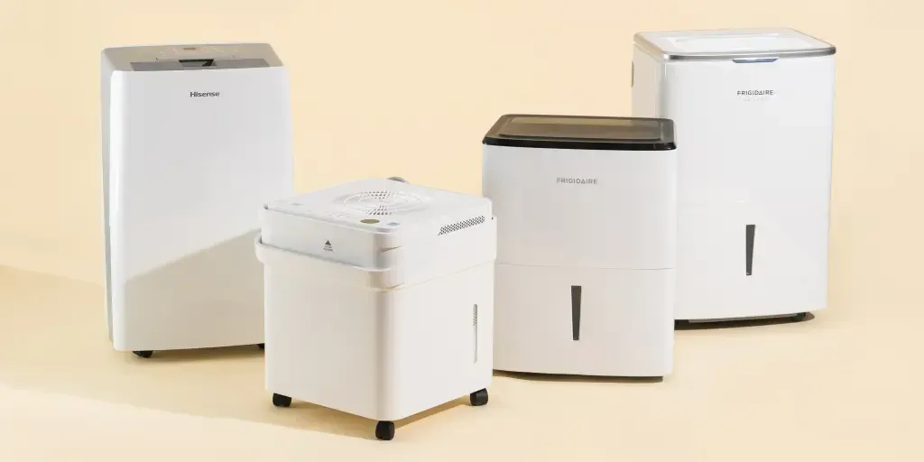 A group of air purifiers are sitting next to each other on a table. A group of air purifiers are sitting next to each other on a table.