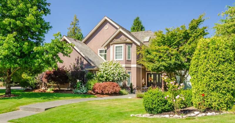 modern victorian house with nice landscaping