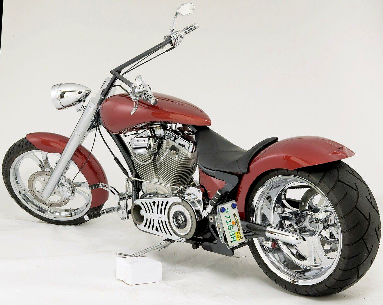 A red motorcycle with a california license plate