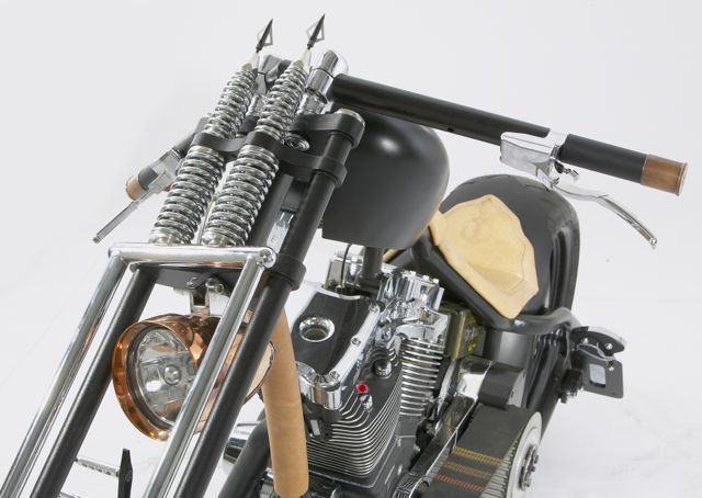 A close up of a motorcycle with a helmet on it
