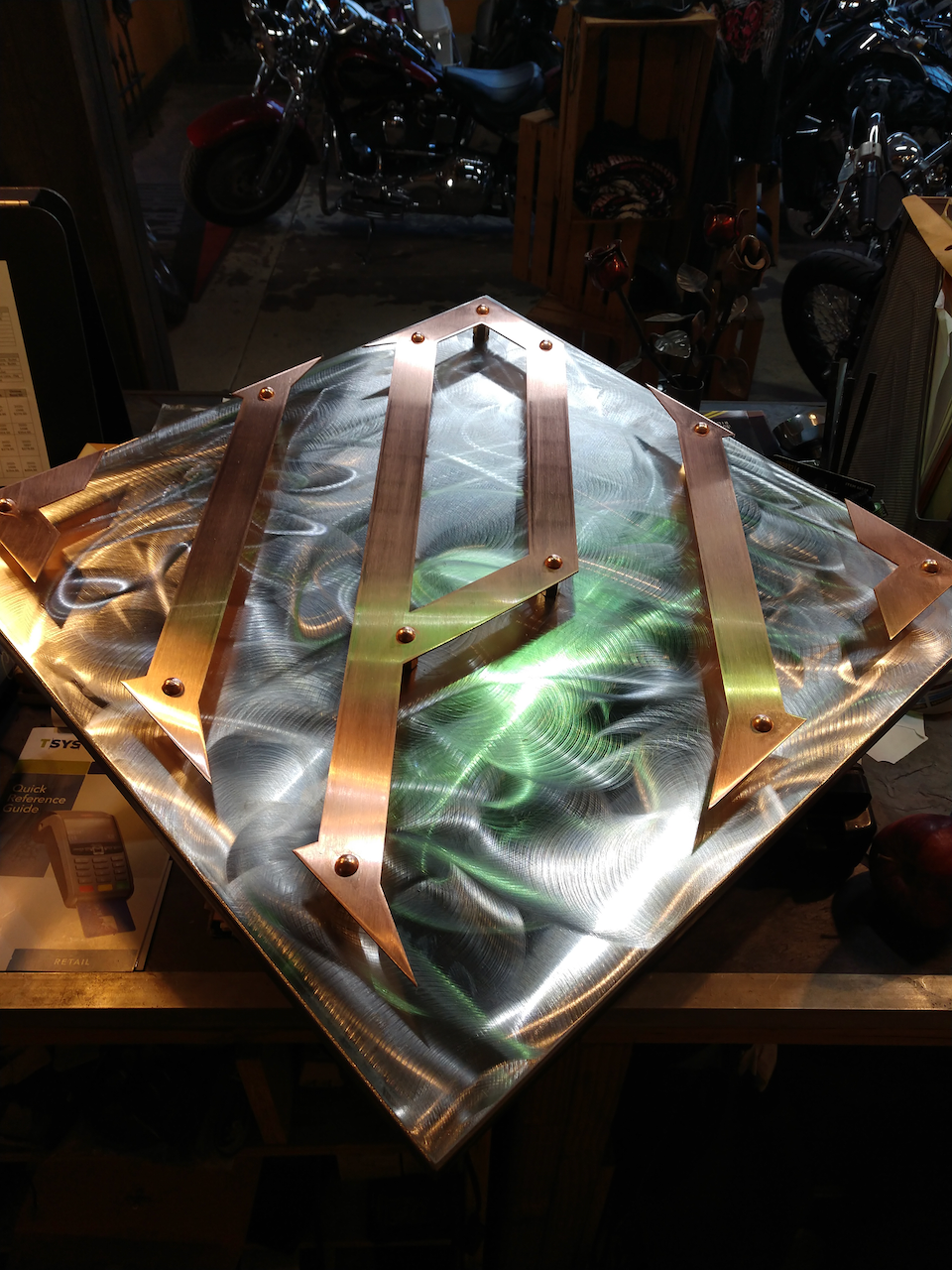 A piece of metal with the letter a on it